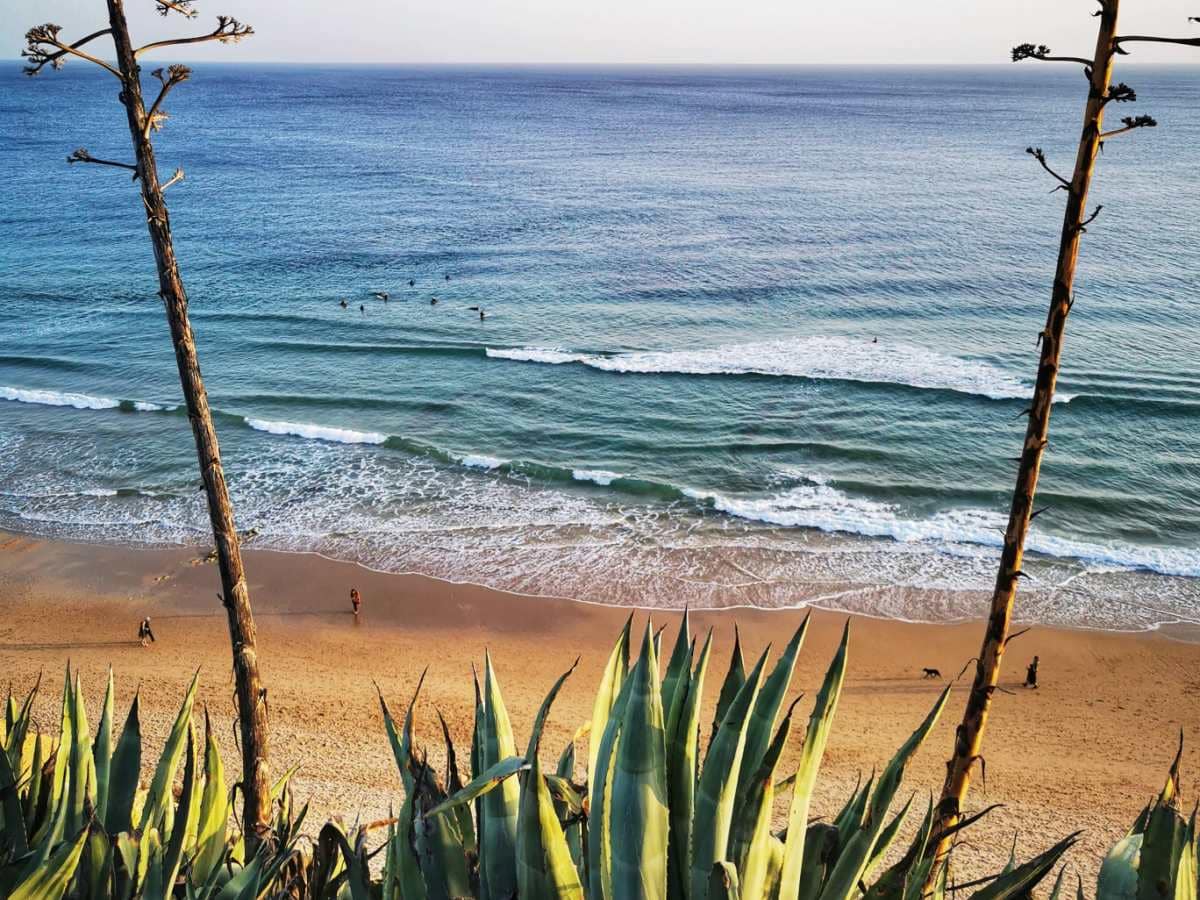Surfers' view of Praia de Porto de Mós beach in Lagos Algarve